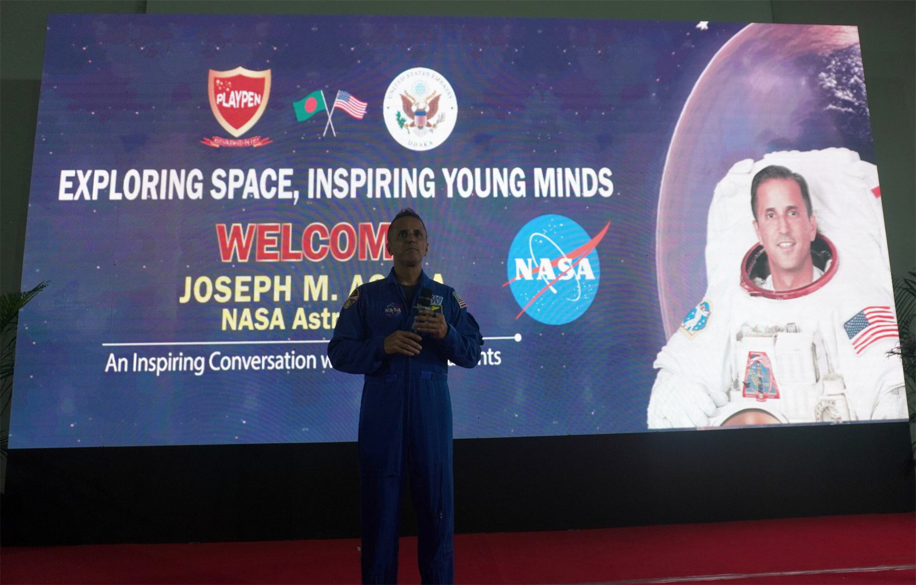 A NASA astronaut speaking to Playpen students